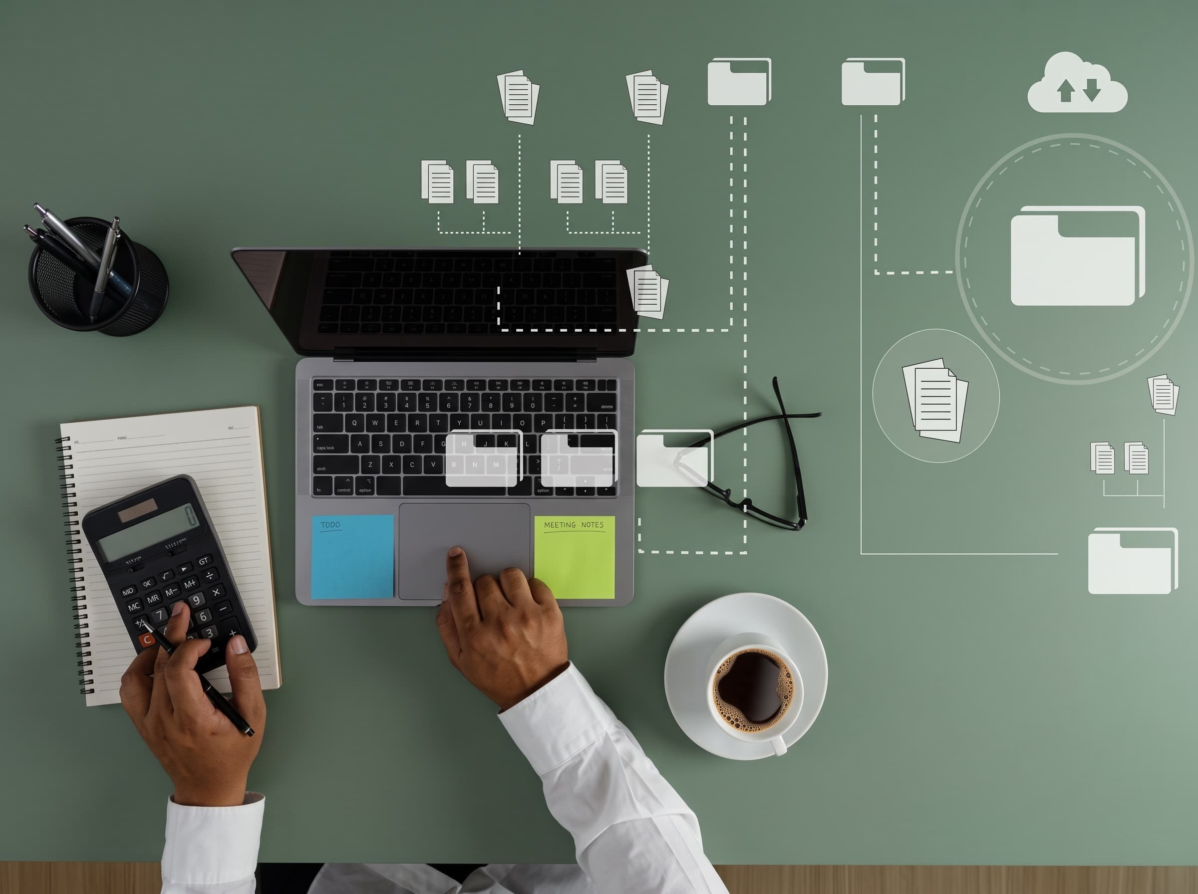 Desk with a laptop and a workflow automation diagram